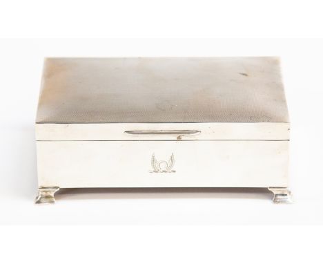 An Elizabeth II silver cigar box, engine turned lid, on bracket feet, Birmingham 1963 