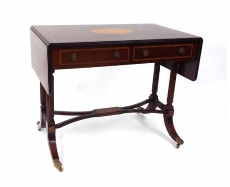 Regency style mahogany inlaid sofa table, the top inset with an oval paterae over two frieze drawers and opposing dummy drawe