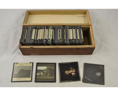 A magic lantern together with a large quantity of slides, some coloured