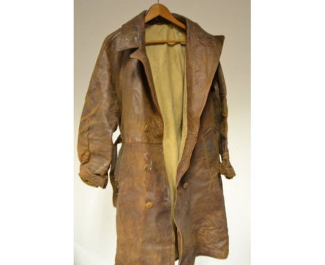 An early 20th century flying coat, full length, brown leather, blanket lining, belt with metal buckle, together with a Brookl