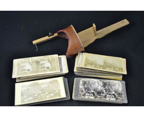 A vintage Stereoscope with thirty eight assorted Stereoscopic slides, including Isle of Wight CONDITION REPORT: Condition com