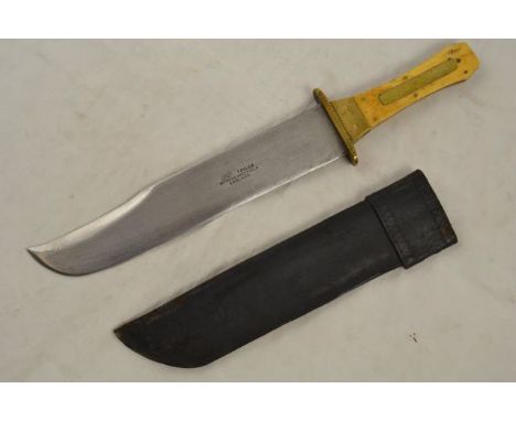 A 19th century Bowie knife, the 25cm blade inscribed Taylor Witness, Sheffield, England, brass mounted bone hilt, leather she