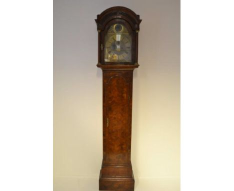 An early 18th century walnut long cased clock, arched hood with blind fret decoration, side viewing panels, shortened case wi