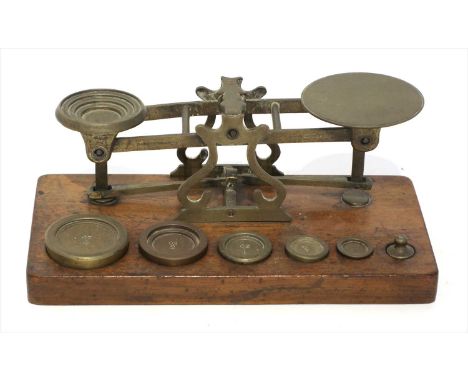 A set of brass postal scales, made by Sampson Mordan &amp; Co., retailed and stamped by 'Parkins &amp; Gotto 24 &amp; 25 Oxfo