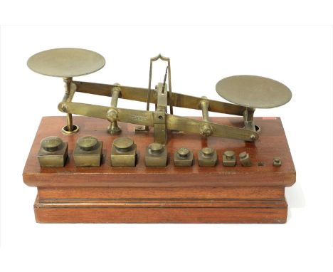 A set of brass roberval postal scales, by Edmund Ratcliff, stamped 'Waterflow &amp; Sons Manufacturers London', c.1865, the m