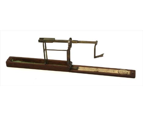 A rosewood folding brass sovereign balance, R Brown &amp; Co., Prescot, retailed L Samuel of Liverpool, c.1812/35, with inter