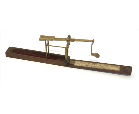 A mahogany cased brass folding coin scale, by R D Brown, 19th century, with internal label, 29cm long