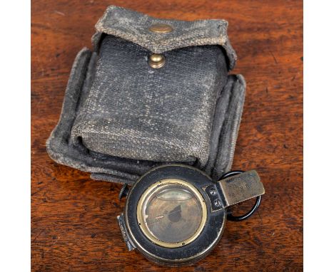 A World War II compass by T. G. Co Ltd, with canvas pouch, formerly belonging to Brig. R.M. Carr MBE DFCIn used and worn but 