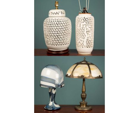 A cast metal table lamp with domed glass shade (39cm diameter x 55cm high); together with two pierced pottery table lamps; an