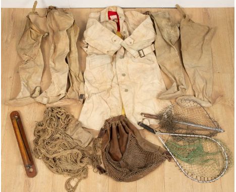 A box of sporting equipment to include wading boots, game carrier, various fishing catch nets, and a fisherman's bag, etcAll 