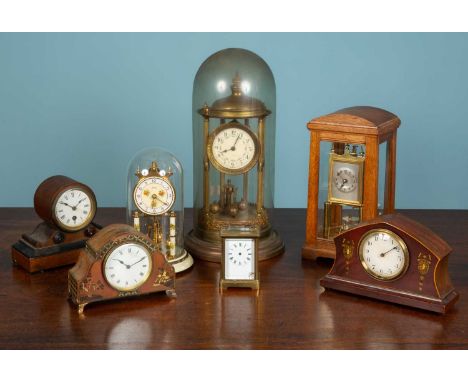 An assortment of seven timepieces comprising of one small brass carriage clock marked to the bottom and initialled to the rev