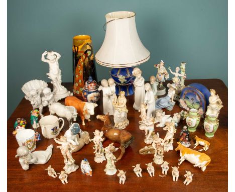 A various assortment of ceramics, comprising of one tall vase, seven Nao figures, two commemorative cups, one mouse, five Bes