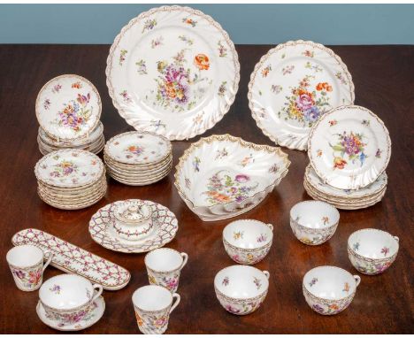 A collection of Dresden porcelain, cups and saucers, dishes, and an inkwellAll with some slight wear to the gilding, one teac