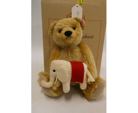 Steiff "Teddy's Elephant" bear, a 24cm bear holding a felt elephant, with ear button, label and certificate, boxedCondition R