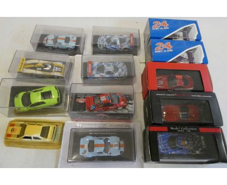 Diecast 1:43 scale Chinese made model racing cars including Ford GT40, Ferrari and Nissan, all items boxed, mint