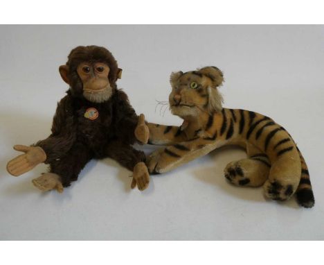 Two vintage Steiff animals, comprising a Jocko monkey and a tiger, both with card labels, Jocko with ear button and fabric la