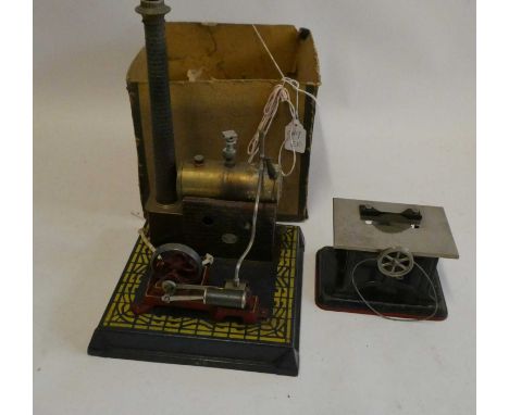 Plank stationary steam engine, number 350, box at fault, model fair and a small table saw accessory with drive belt, good