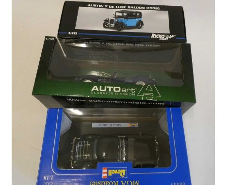 Three 1/18th scale diecast cars comprising Ricko Austin 7 saloon, Auto Art Jaguar D Type, Revell MGA Roadster and Burago Merc