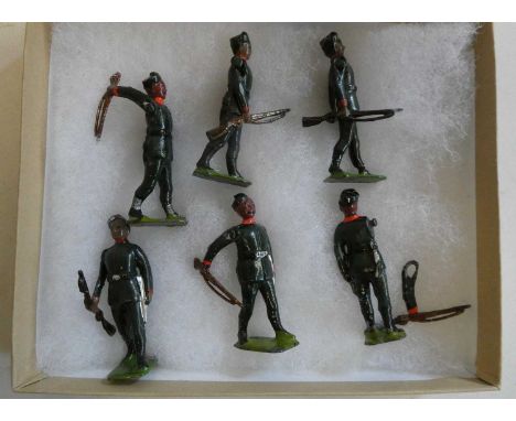 Britains Gurkha rifles figures comprising six soldiers with swinging arms and rifles, one item has paint chip and arm is deta