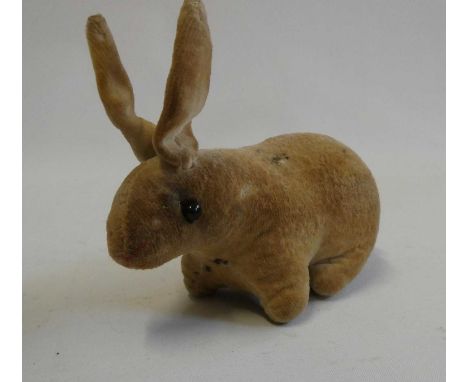 An early velvet rabbit, possibly Steiff, with shoe button eyes, 5" longCondition Report: Generally good, some minor staining.