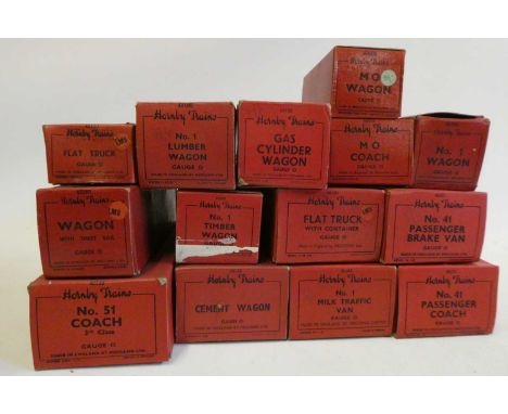 Seventeen post-war Hornby wagons and coaches, all item boxed, some storage wear, good to excellent