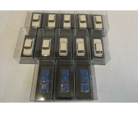 Diecast 1:43 scale cars comprising 10 Morris 110 1967 in white and three blue Ford Anglia, all items boxed, mint