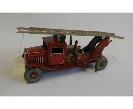 Mettoy clockwork fire engine with escape ladder and three firemen. Overall condition excellent, marks on front L/H wing