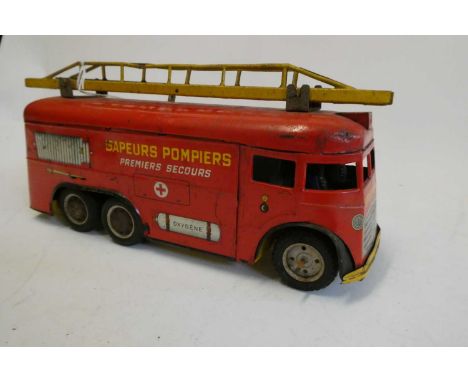 Joustra France Sapeurs Pompiers clockwork fire engine, some rusting to bodywork and paint chips, one with hubcap missing, con
