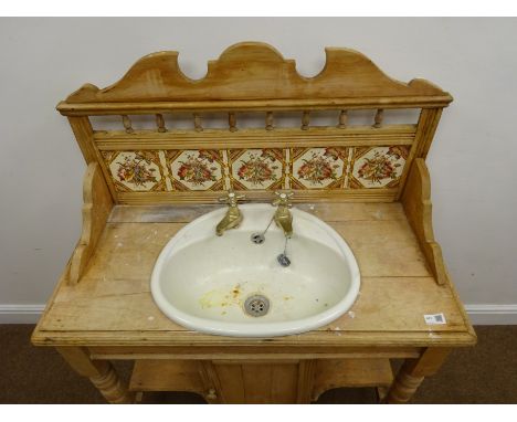 Victorian stripped walnut washstand, raised shaped back with turned gallery and tiles, basin with brass taps, turned supports
