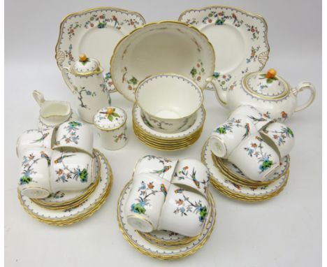 Art Deco Tuscan China tea service, enamelled with birds amongst foliage within black trailing border 