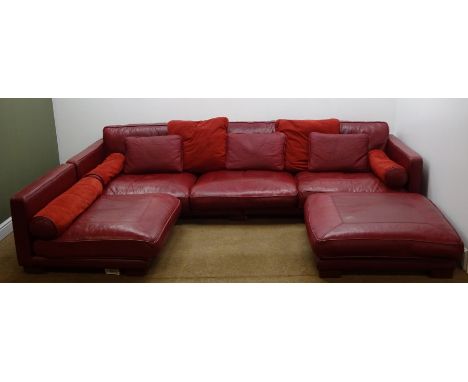 Large corner sofa group upholstered in red leather with footstool