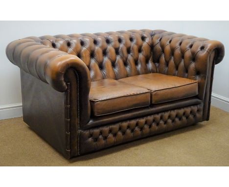 Chesterfield two seat sofa upholstered in deep buttoned brown leather, W150cm