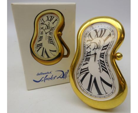 Softwatch Salvador Dali inspired strut clock, white enamel dial with Roman numerals within polished brass frame, easel back, 