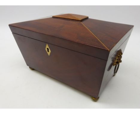 19th Century mahogany and boxwood strung tea caddy, sarcophagus form, lion mask brass ring handles on brass bun feet, L24cm 