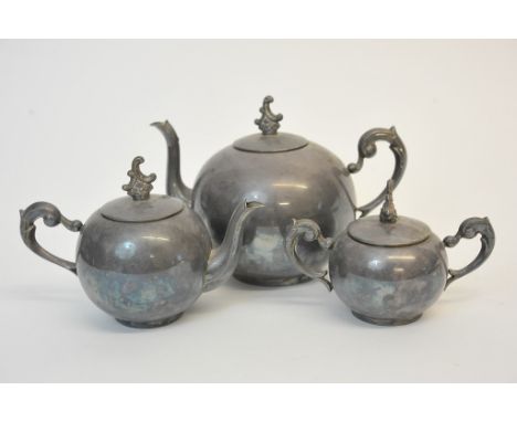 A continental silver tea set comprising a large teapot, a smaller teapot and a small twin handled sugar bowl