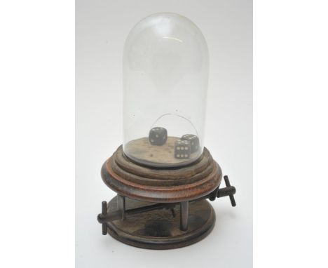An unusual treen dice roller containing three dice under a glass dome