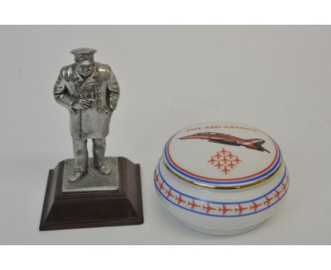 A pewter figure of Winston Churchill standing on a wooden base and a porcelain Red Arrows circular trinket box. 