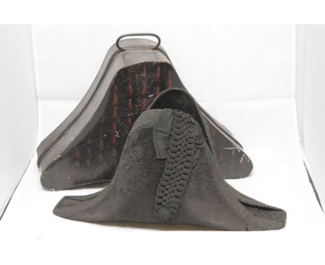 An early 19th Century Bicorne hat, maker Christys' London, in a metal case (slight damage)