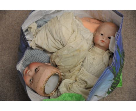 A German Heubach Koppelsdorf bisque headed doll and one other both for restoration 