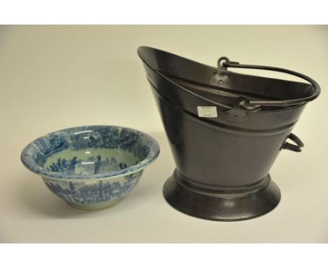 A coal bucket and a large blue & white ceramic bowl.