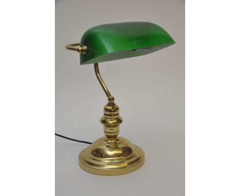 A green glass desk lamp