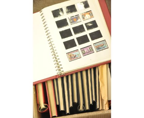A box containing a collection of 13 stamp albums including Great Britain, Canada, Commonwealth etc 