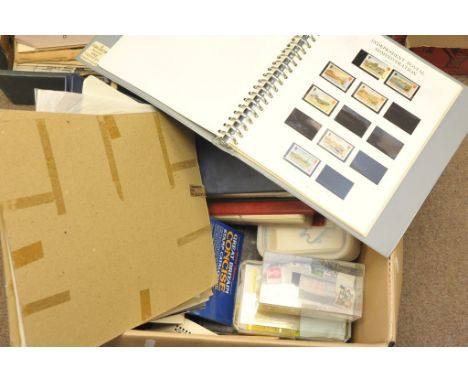 A box containing various postage stamps including channel islands, First Day Covers, loose stamps etc.