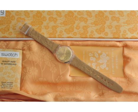 A boxed Swatch watch with original scarf