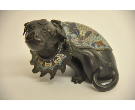 A Chinese bronze and champleve enamel model of a Fu dog in seated position