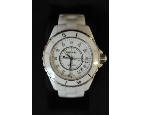 A boxed gents Chanel J12 white ceramic wristwatch with diamond set dial and spare links