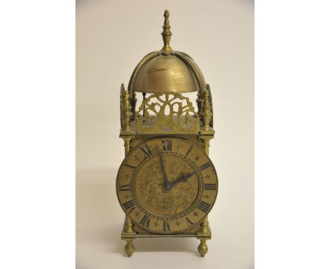 A 20th century brass cased clock in the lantern clock style