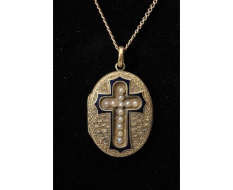 A 19th century yellow metal locket with engraved decorated and mounted with a central seed pearl cross with enamel surround