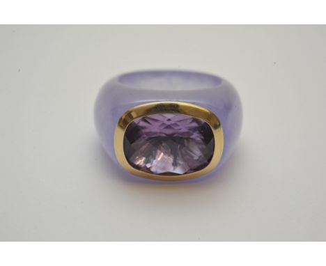 An unusual ladies ring made from solid purple stone (possibly lavender jade) inset with 14ct yellow gold mount set with a fan