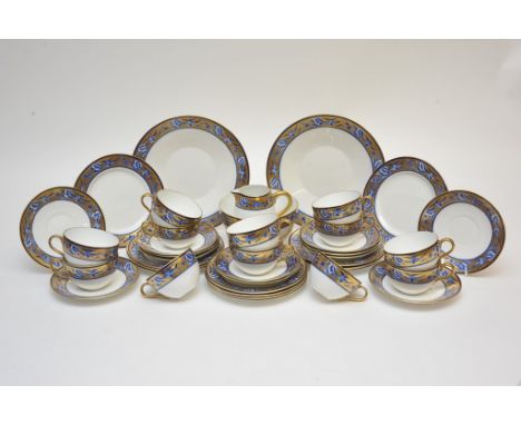 A Shelley twelve piece tea set having gold rims decorated with blue swallows and roses